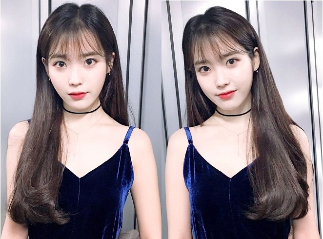 IU trong kiểu tóc dài ngang lưng uốn phồng